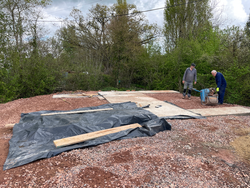17/04/2025  The final pad for the containers cast and protected from the rain. The area between the remaining pads and centre section being levelled up.