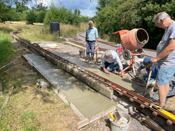 03/07/2025 The first section of the raised track platform being cast.