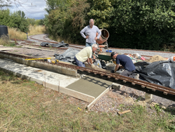 31/07/2025 The ramp being laid at one end of the raised track platform.