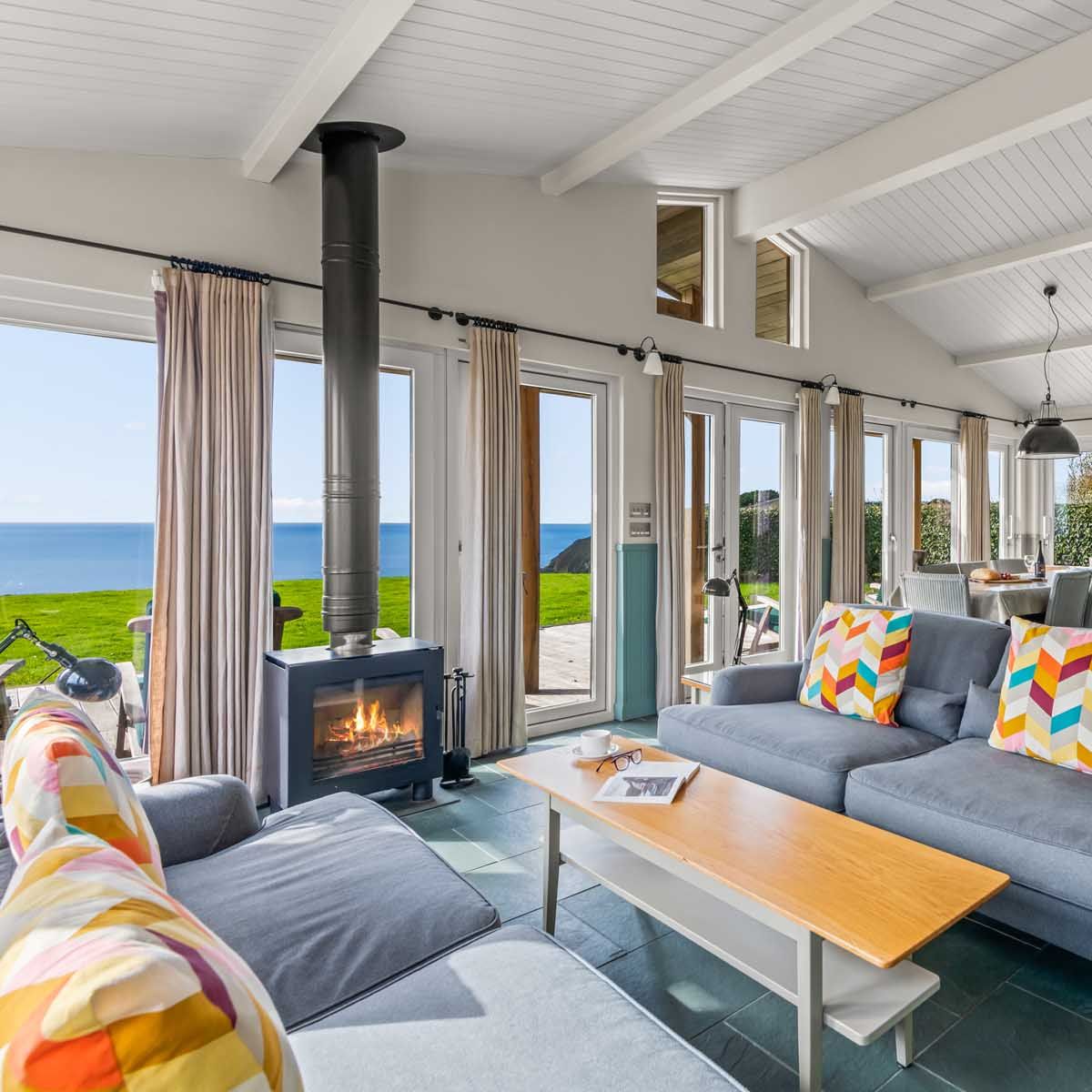 Bright and cozy living room with ocean view and modern decor