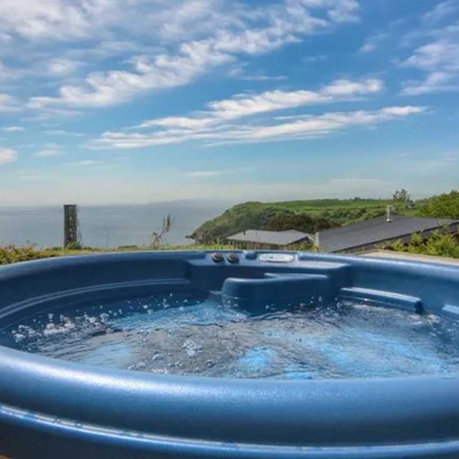Hot tub with panoramic ocean and countryside view