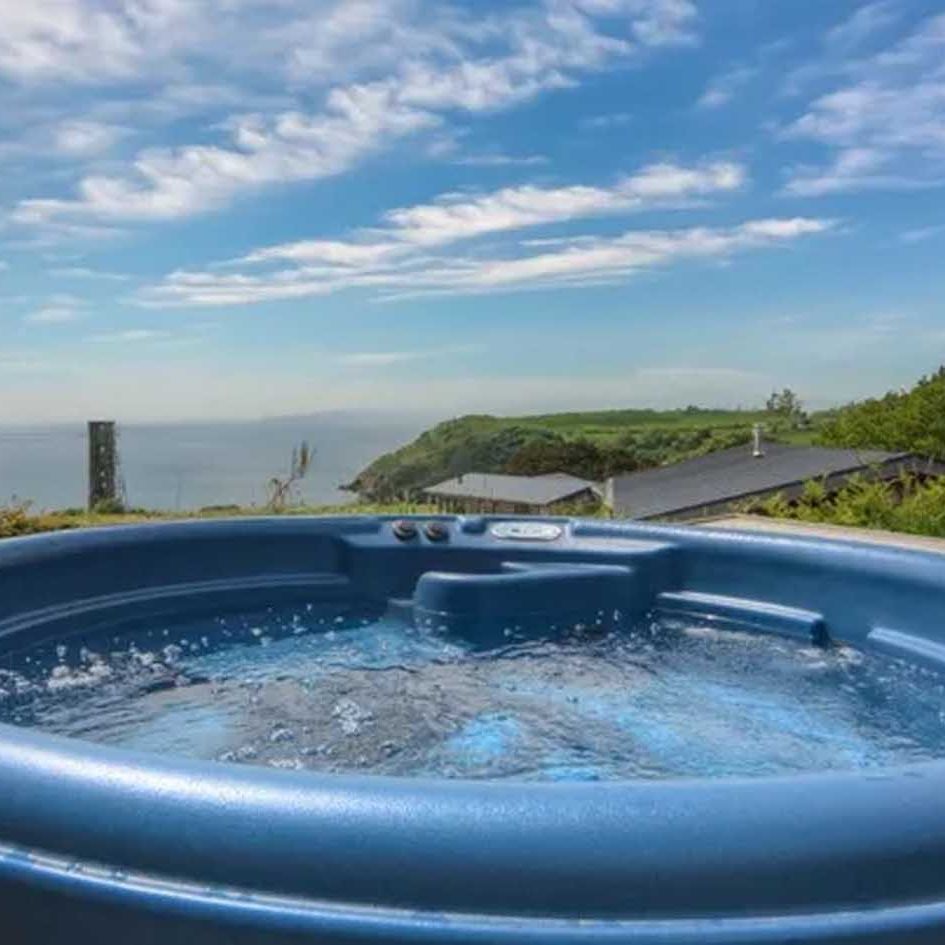 Hot tub with panoramic ocean and countryside view