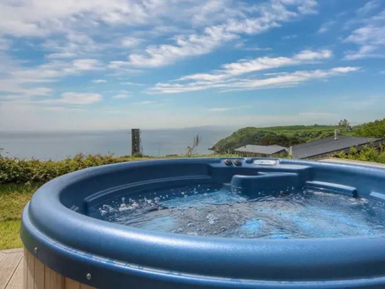 Hot tub with panoramic ocean and countryside view