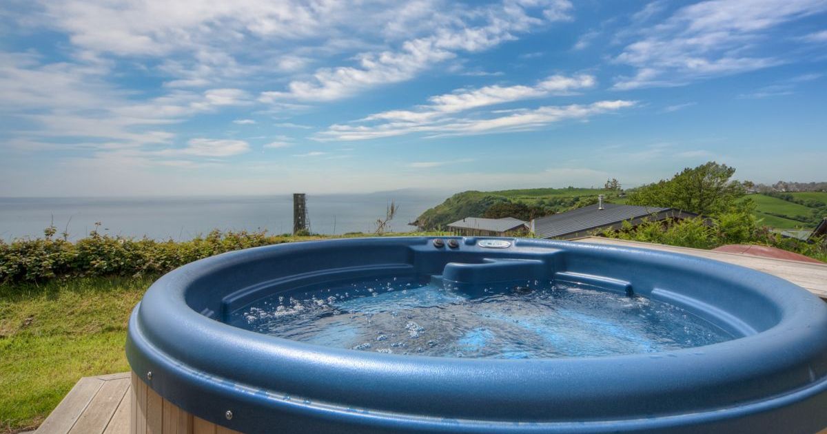 Outdoor hot tub with scenic coastal view