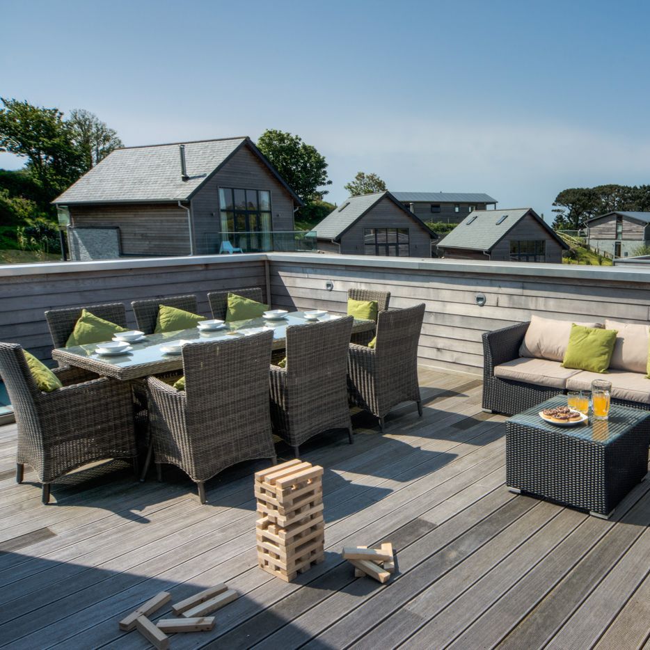 Rooftop patio with outdoor dining and seating area