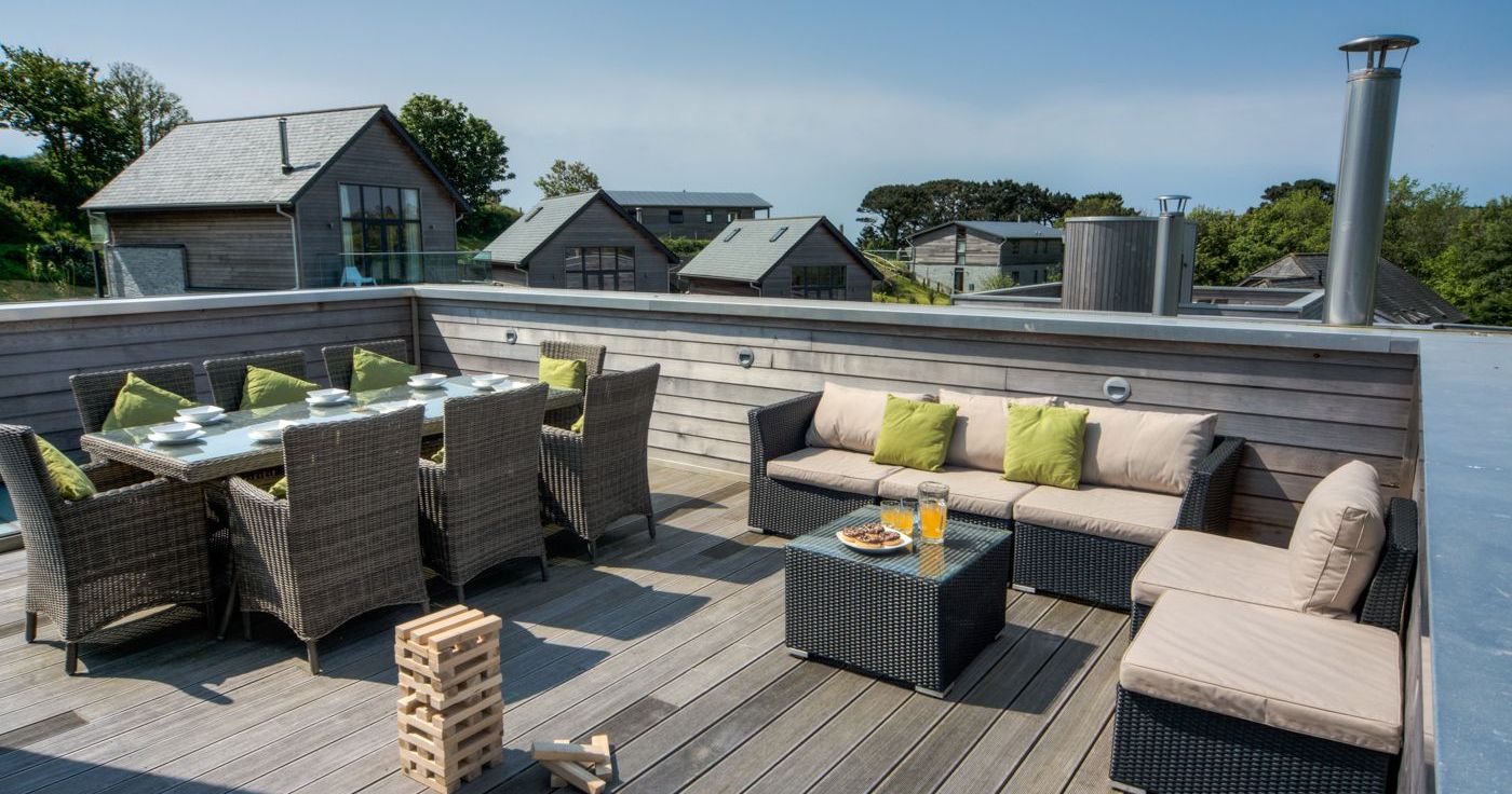 Rooftop patio with outdoor dining and seating area