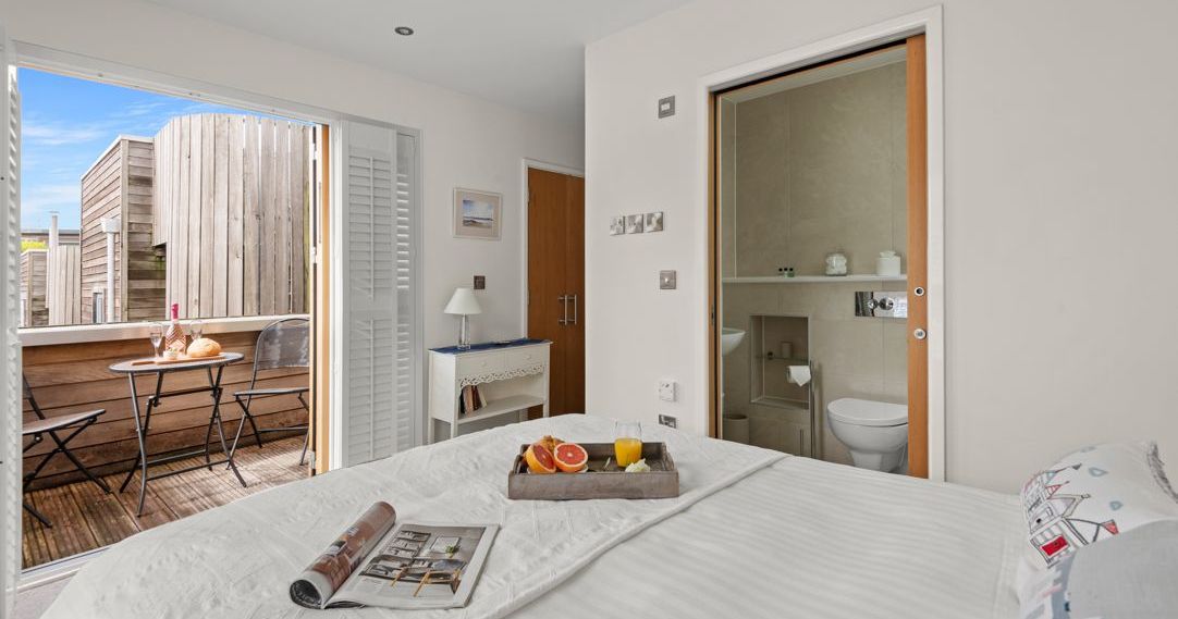 Modern bedroom with en-suite bathroom and private balcony
