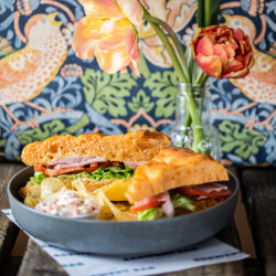 Sandwich with lettuce, tomato and coleslaw