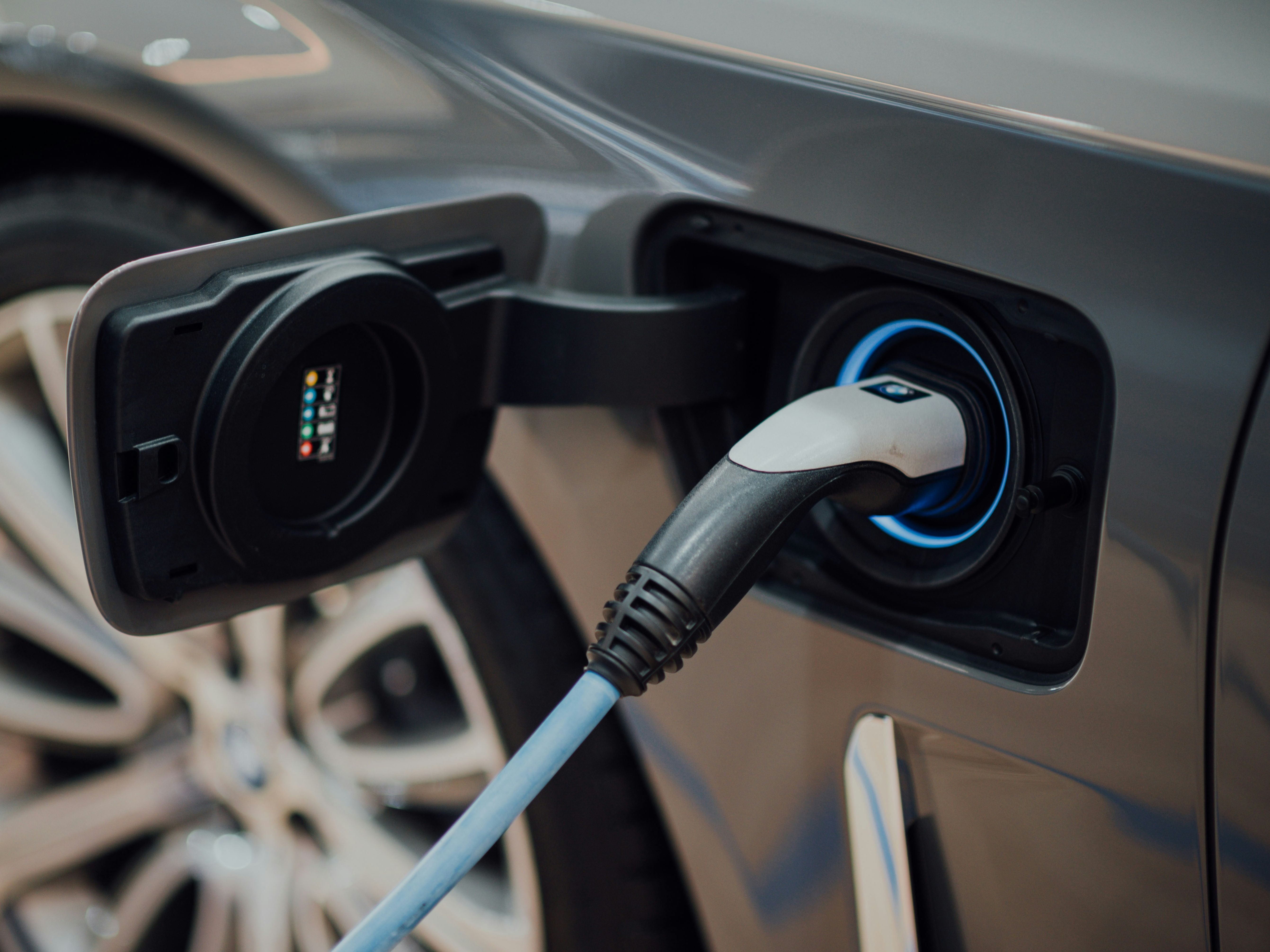 Electric car charging at a charging station