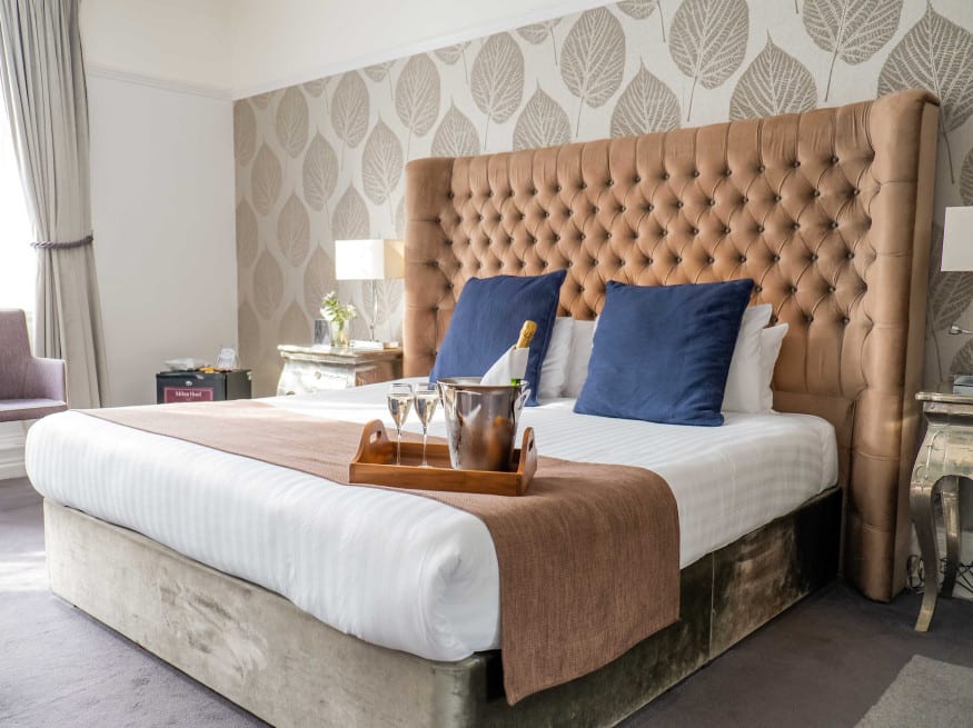 Bedroom with champagne and glasses