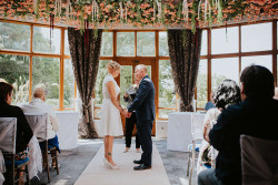 Bride and groom vows in dining room