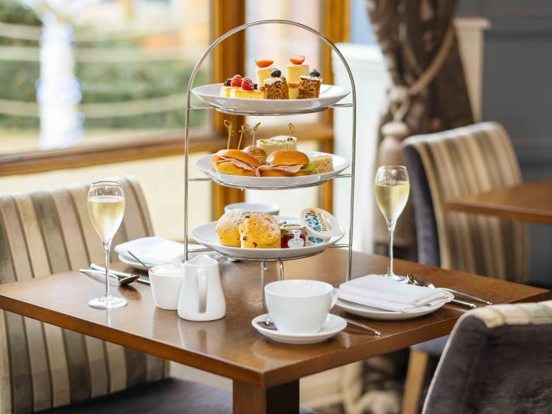 Afternoon tea stand with champagne