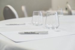 Conference set up - pen and glass on table