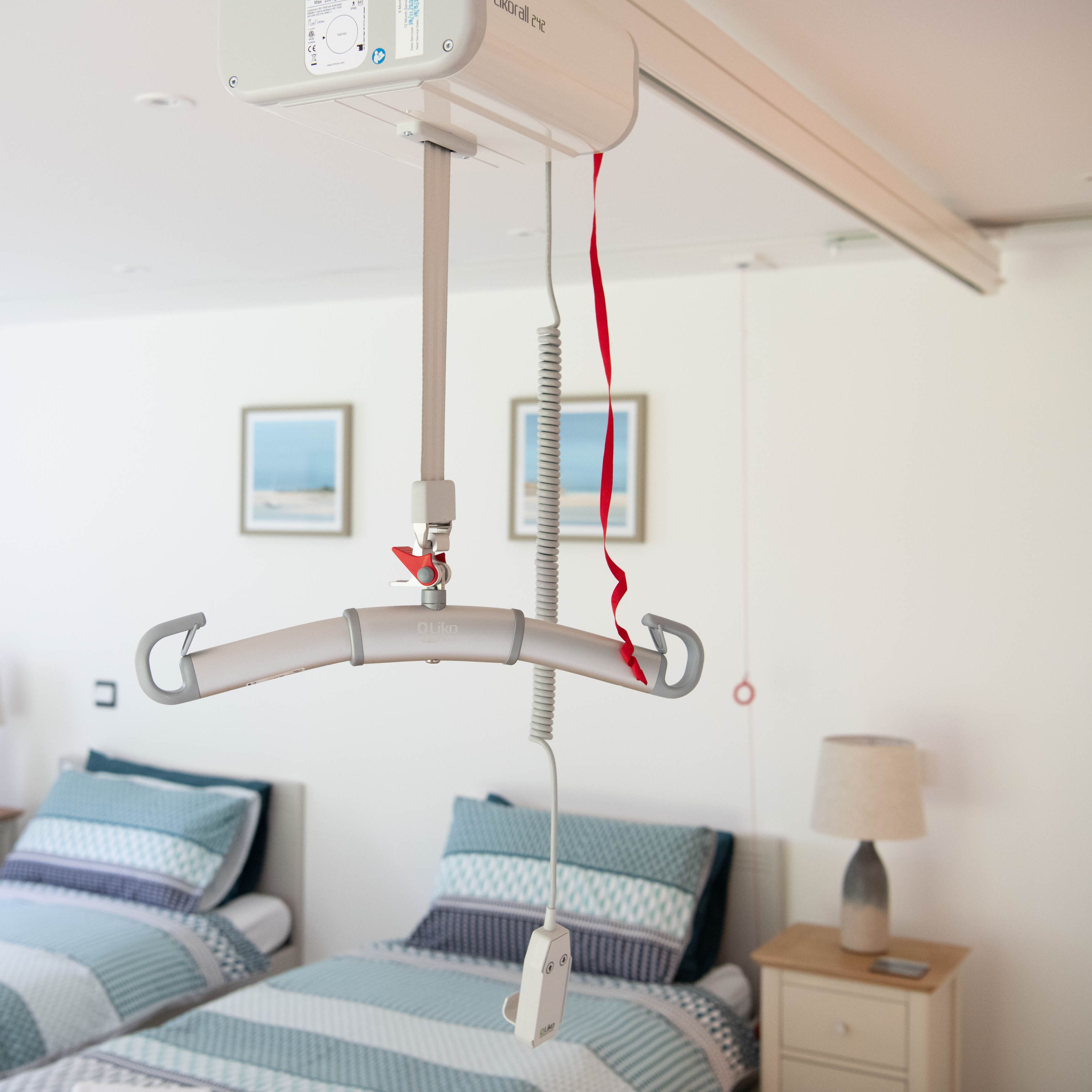 Ceiling hoist in an accessible bedroom with two single beds