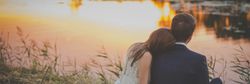 Wedding couple sunset by lake