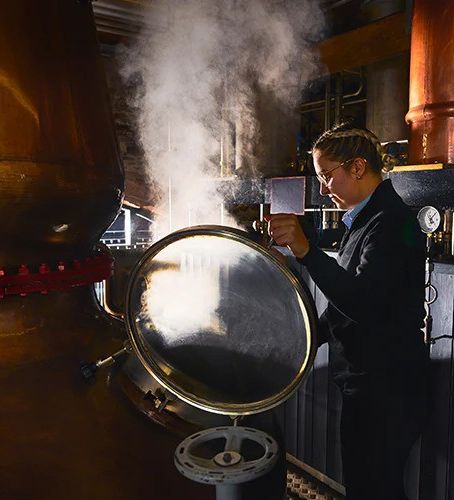 This image is the property of The Lakes Distillery in the Lake District. A skilled worker crafts their world famous Lakes whiskey.