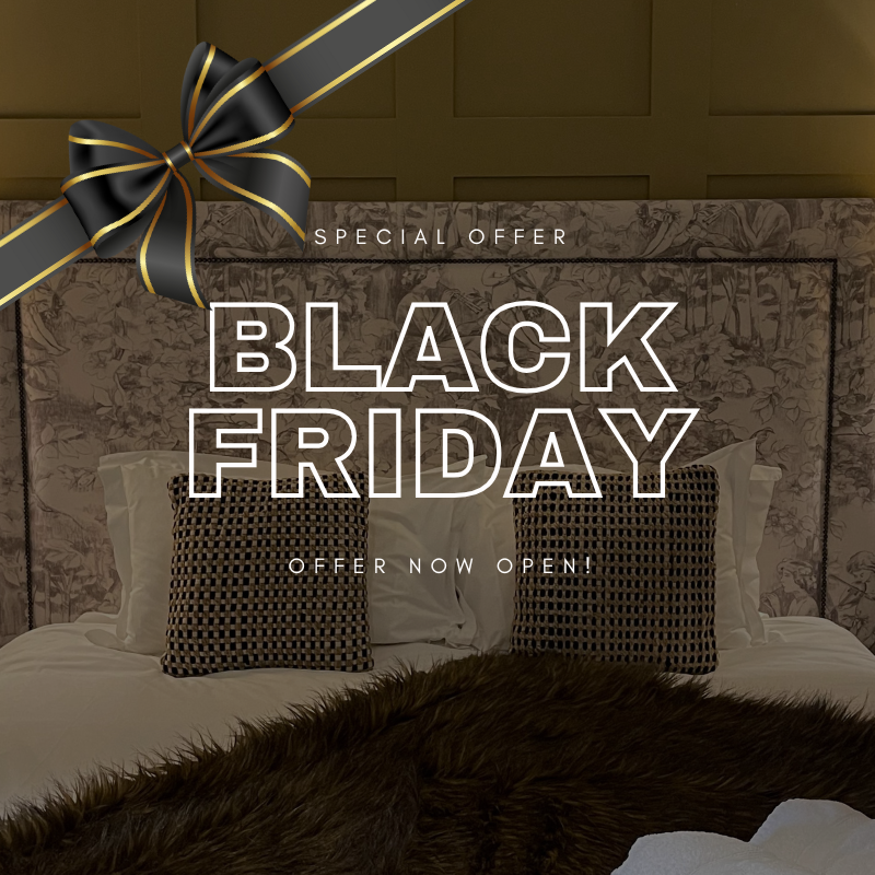 Black Friday special offer promotional image featuring a stylish bed with decorative pillows and a large black ribbon.