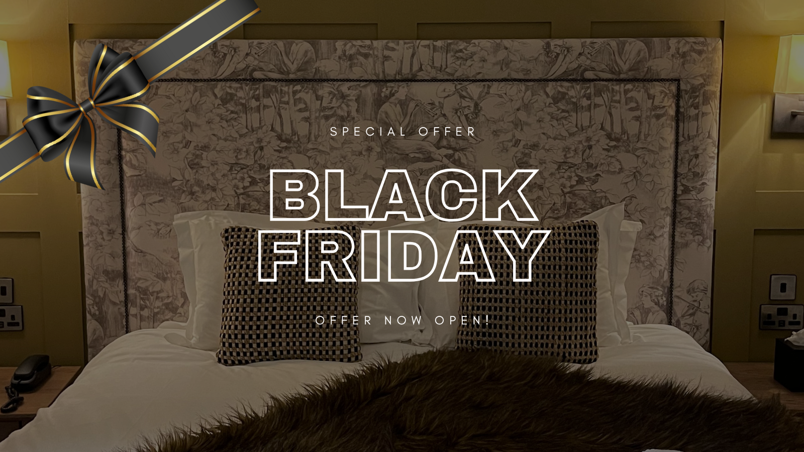 Hotel room with decorative pillows and a 'Black Friday Special Offer' promotion overlay with a black and gold ribbon.