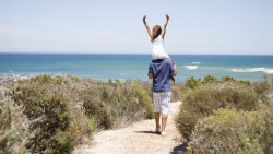 Father Carrying His Daughter To The Beach - Trenance Farm Cottages