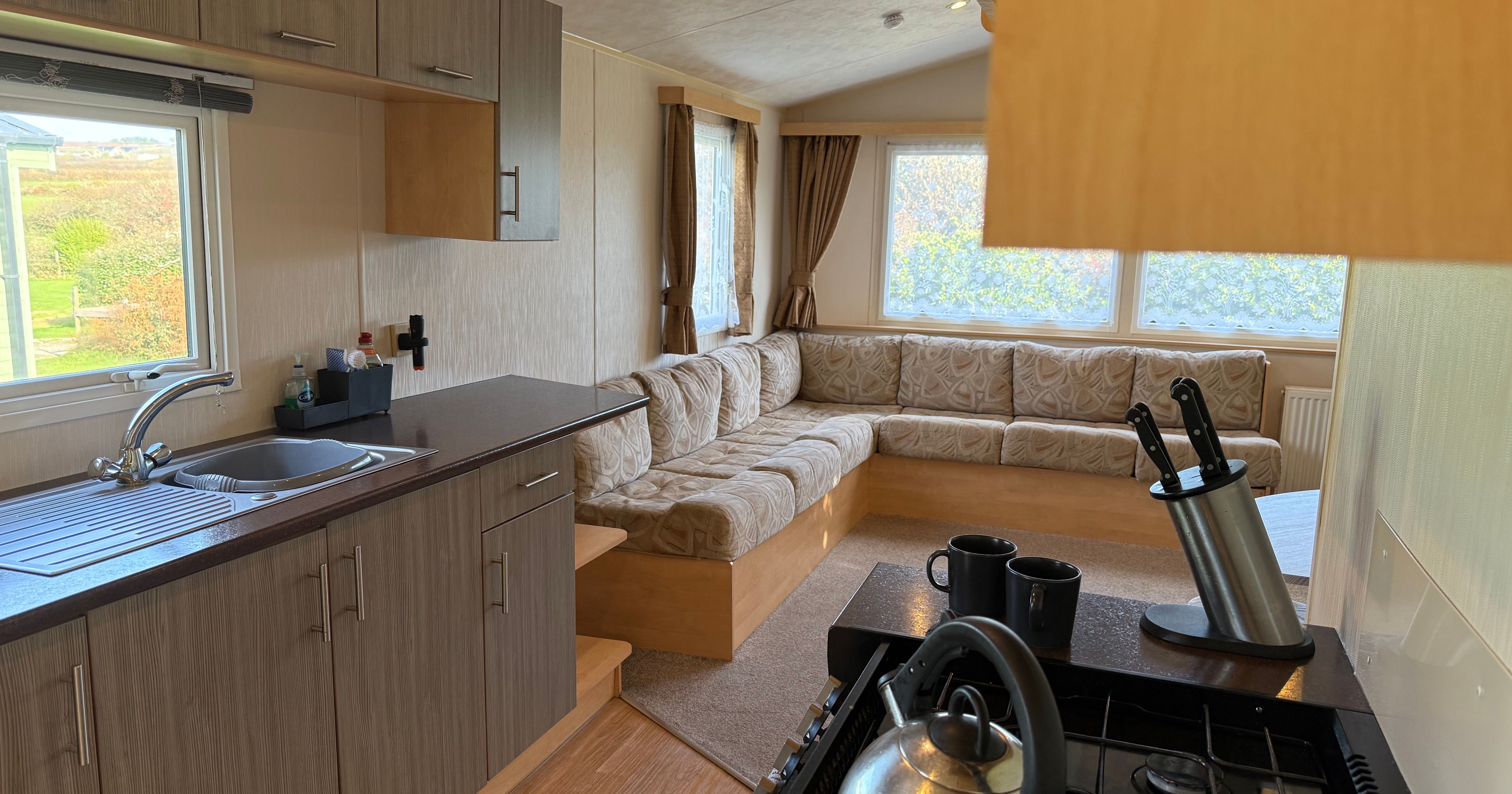 Interior of a modern caravan or mobile home kitchen and living space