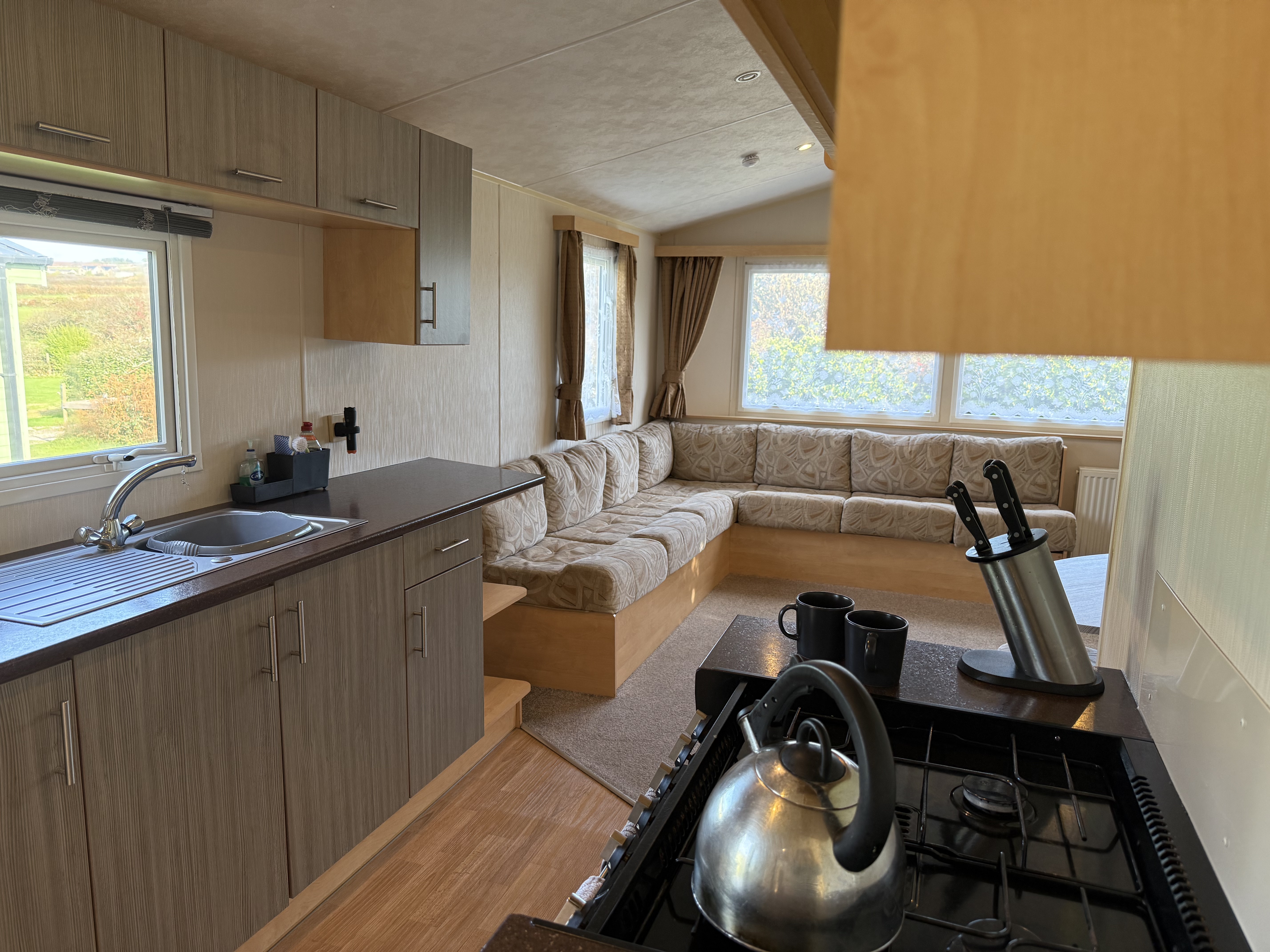 Interior of a modern caravan or mobile home kitchen and living space
