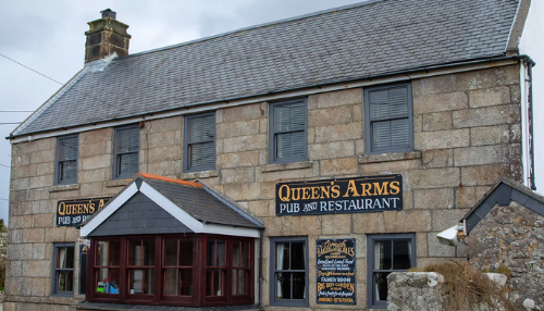 Stone building with signs reading 'Queen's Arms Pub and Restaurant'