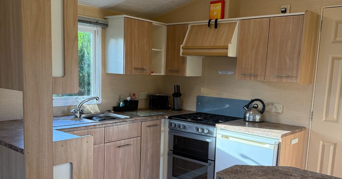 Modern compact kitchen inside a mobile home or caravan