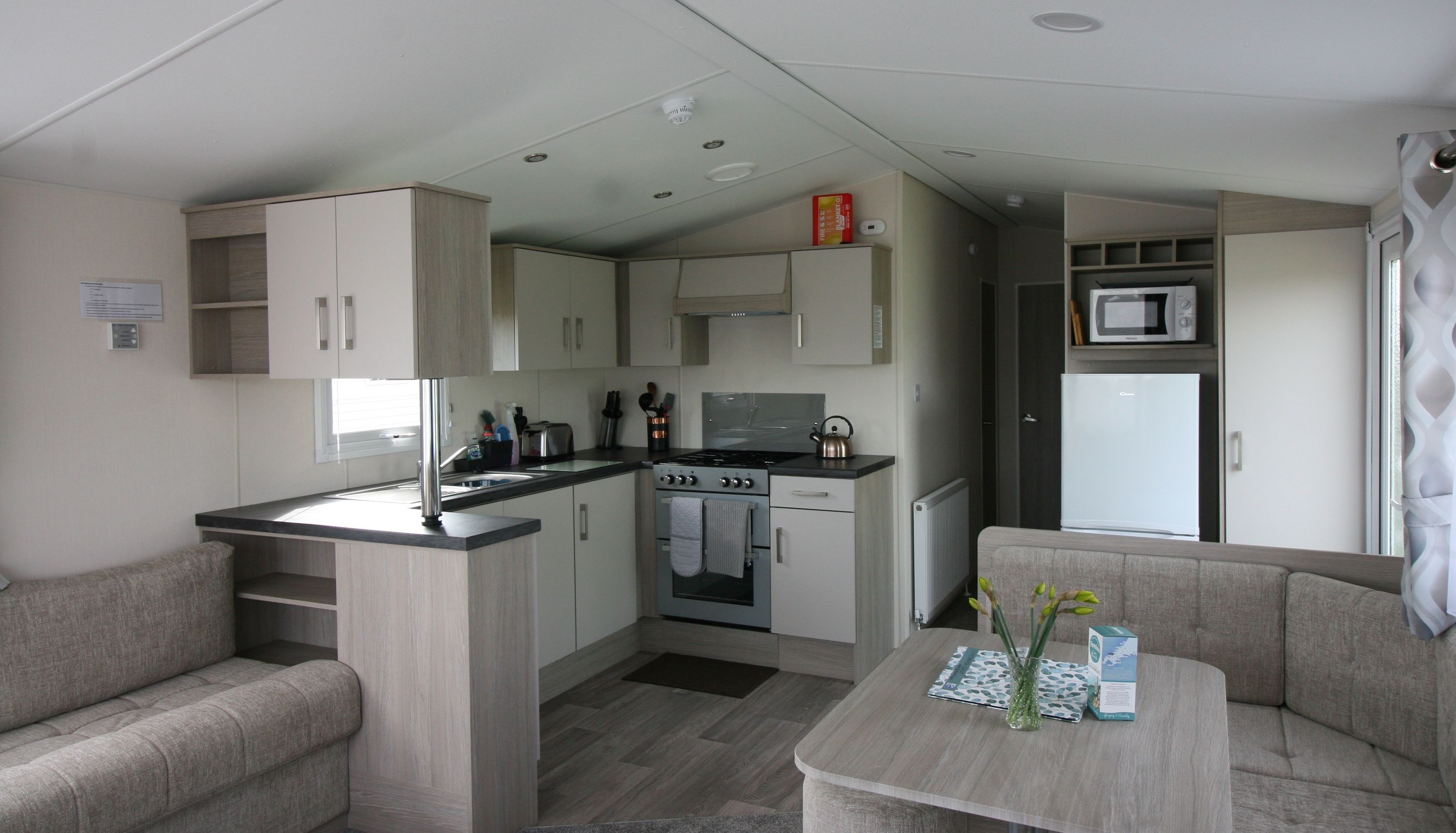 Modern compact kitchen and dining area in a small apartment or mobile home