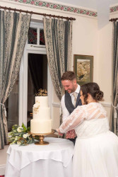Louise Richey - Bride and groom cutting cake