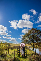 Maggie McCall - bride and groom outside