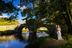 Maggie McCall - bride and groom outside