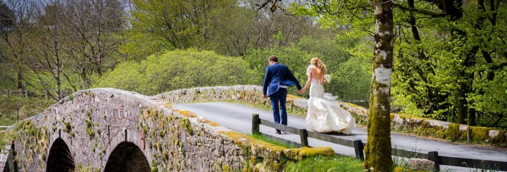 Maggie McCall - bride and groom on bridge
