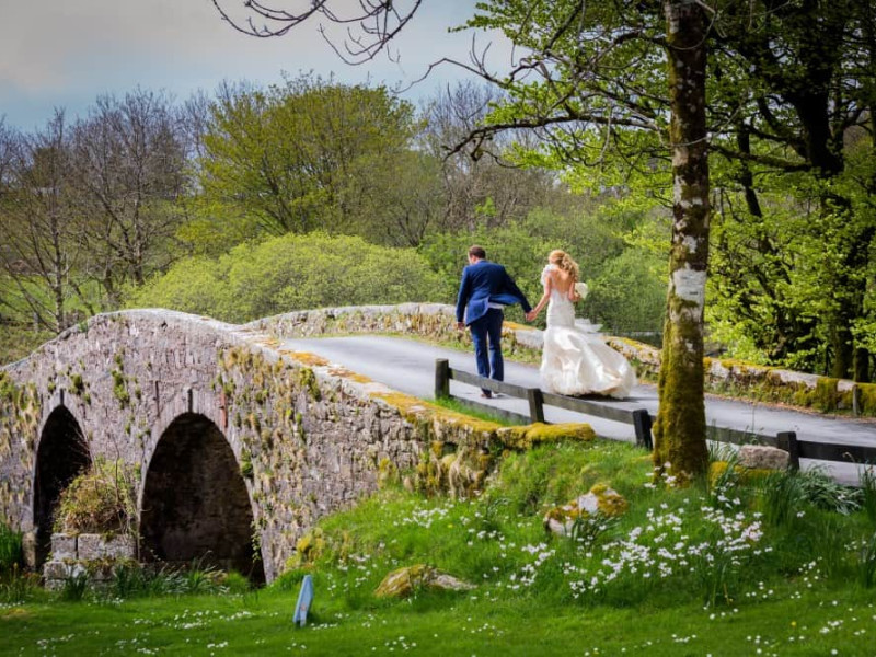 Maggie McCall - bride and groom on bridge