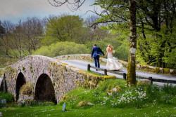 Maggie McCall - bride and groom on bridge