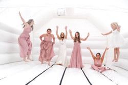 Richard Palmer - bride and bridesmaids on bouncy castle