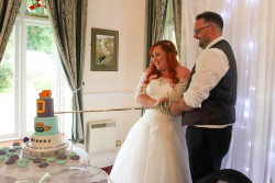 Lauren Spinks - bride and groom cutting cake