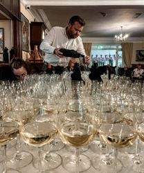 Pouring wine at wine tasting dinner