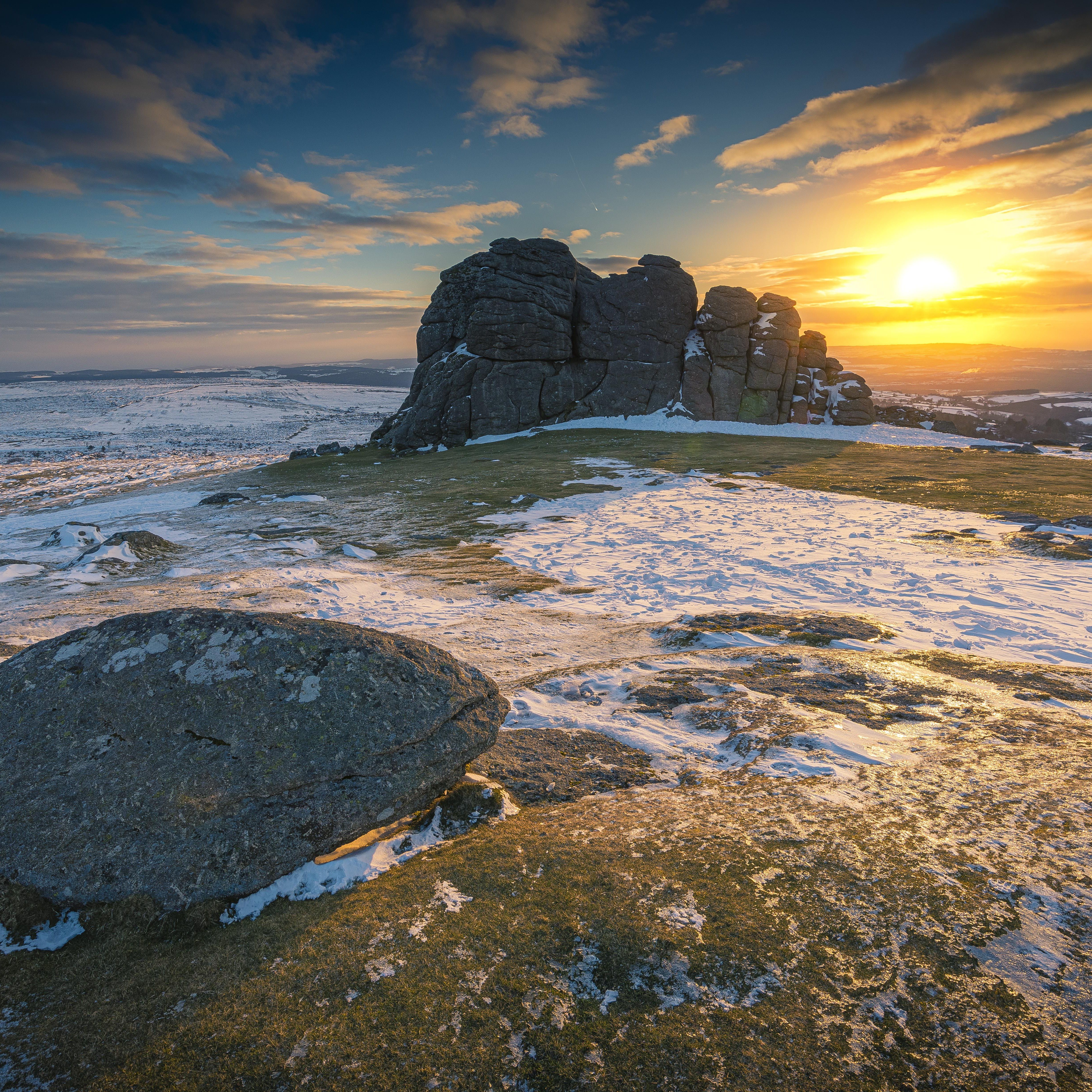 Rocky landscape with snow at sunset