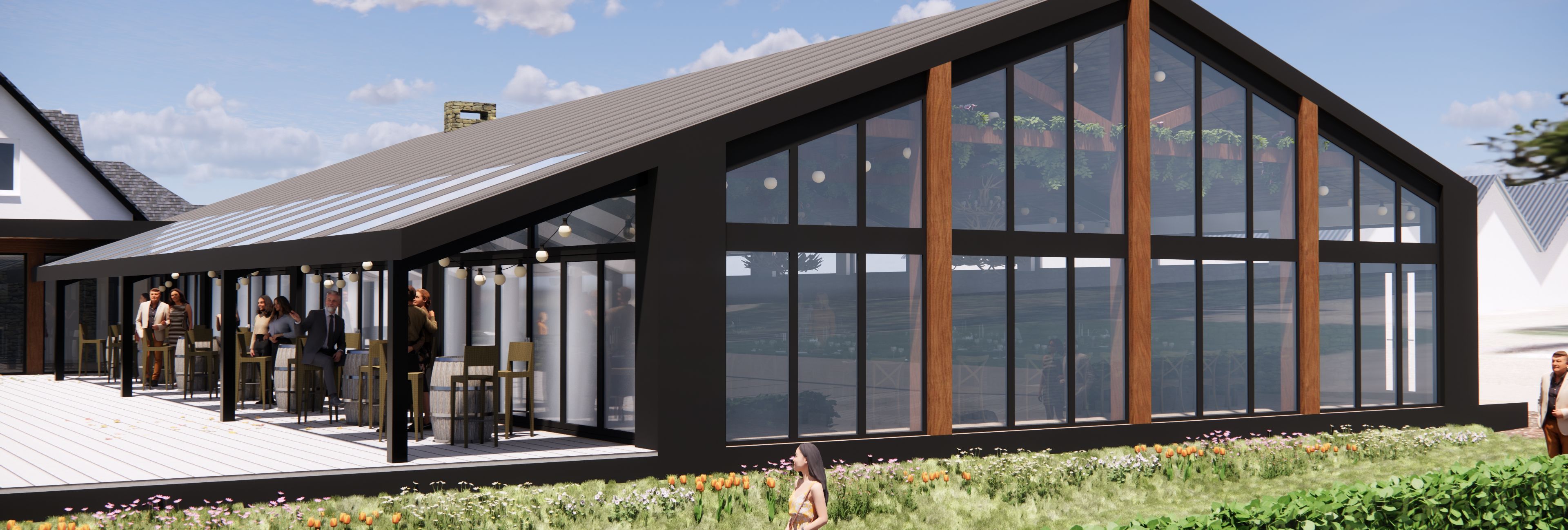 Modern greenhouse-style restaurant with people socializing on outdoor patio