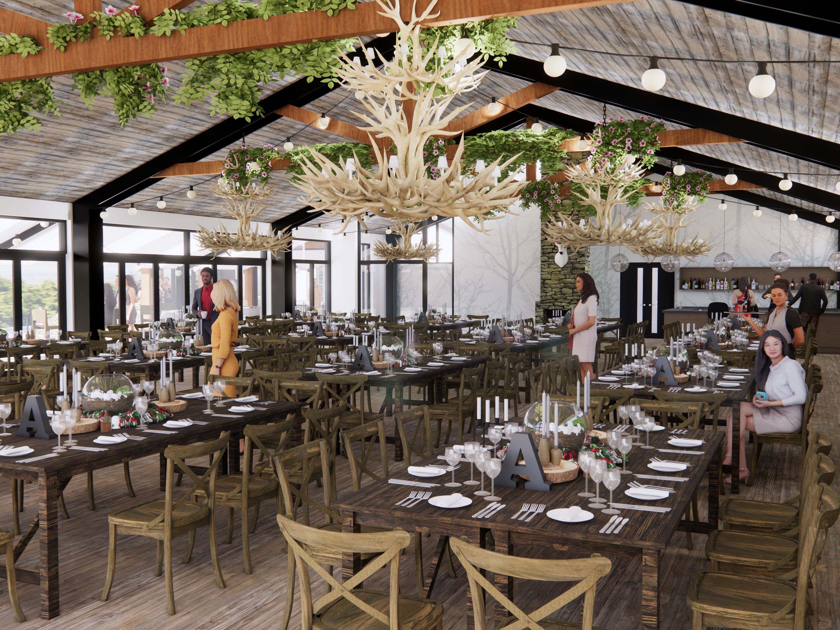 Rustic indoor event space with wooden tables, antler chandeliers, and guests mingling.
