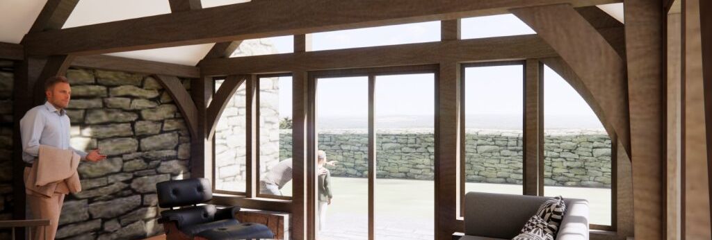 Modern rustic living room with exposed wooden beams, stone walls, and large windows letting in sunlight. A man stands inside while another person is visible outside through the glass doors.