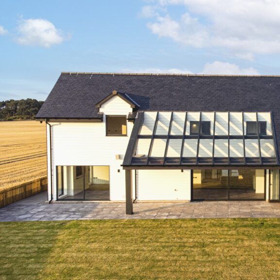 Modern house with large glass roof and skylights