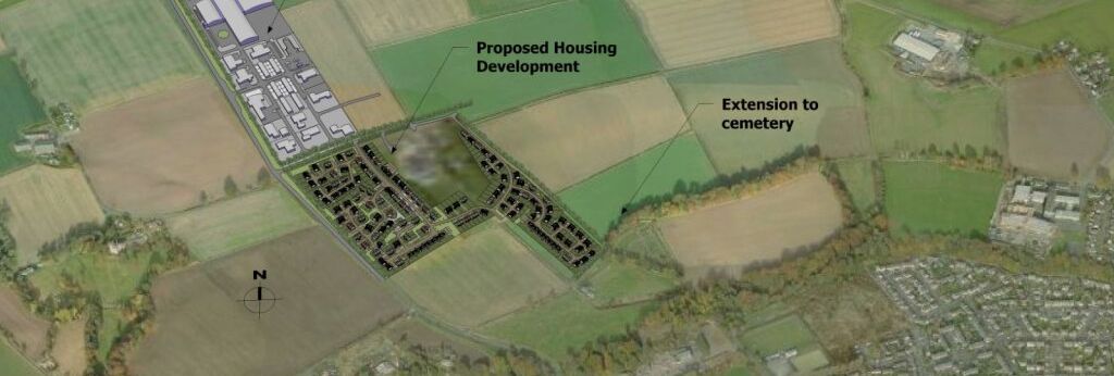 Aerial view of a rural area with labeled zones for a proposed industrial estate, housing development, and cemetery extension.