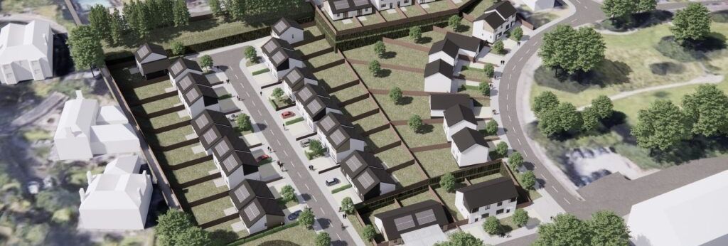 Aerial view of a planned residential housing development with rows of houses, roads, and green areas.