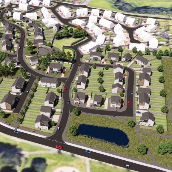 Aerial view of a new housing development with roads, houses, green spaces, and a pond.