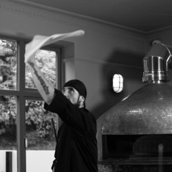 Chef Tossing Pizza