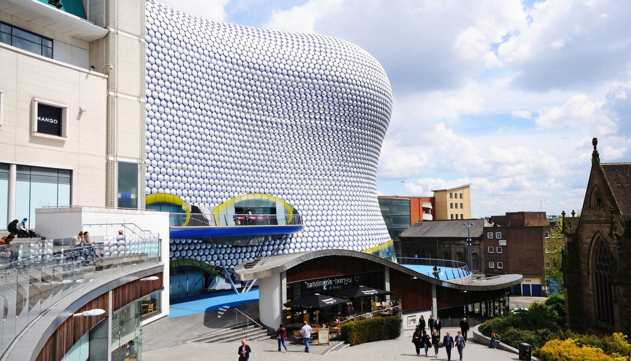 The wavy, bubble-covered Selfridges building in Birmingham, with shoppers in the foreground.
