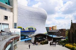 The wavy, bubble-covered Selfridges building in Birmingham, with shoppers in the foreground.