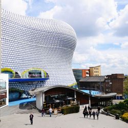 The wavy, bubble-covered Selfridges building in Birmingham, with shoppers in the foreground.
