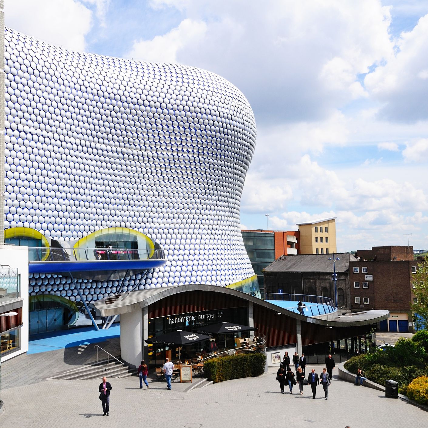 The wavy, bubble-covered Selfridges building in Birmingham, with shoppers in the foreground.
